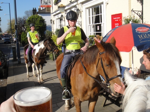 Park Lane Stables Man Drinking Beer on Horse