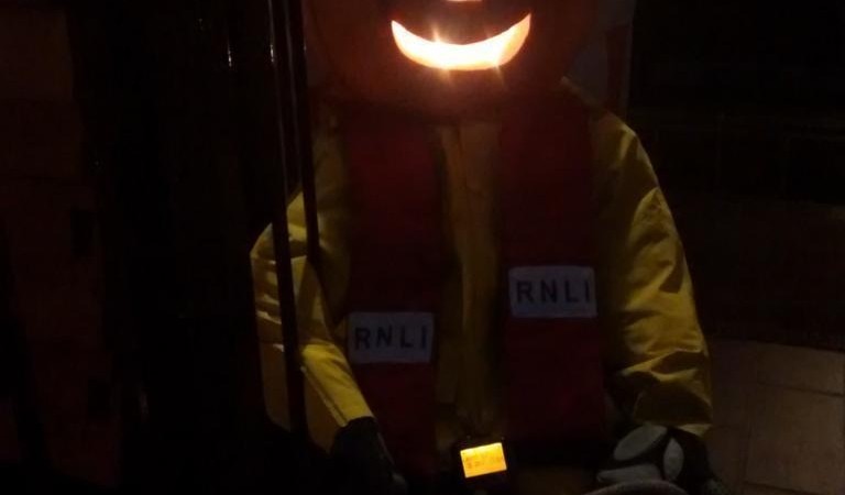 Rick O'Treat (crew no 13 at Teddington RNLI) practises his bowlines as he waits for a Halloween shout
