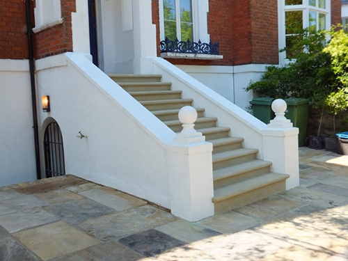 White front of house stairs by Azara Gardens