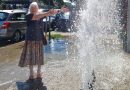 BURST WATER PIPE PROVIDES INSTANT STREET SHOWER