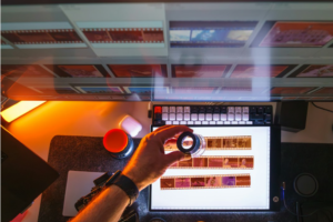 A close-up of hands stretching at a computer workstation